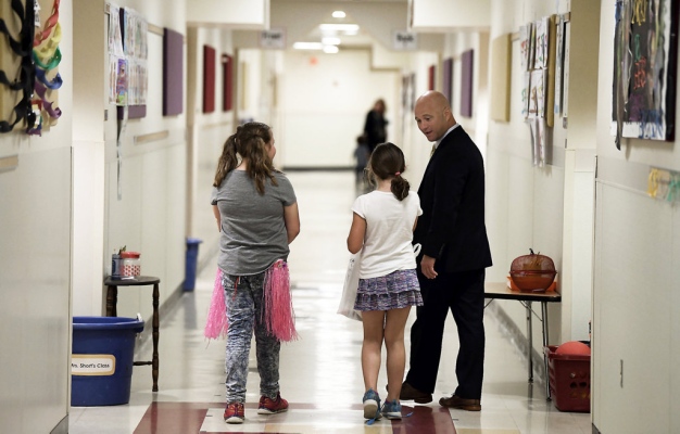 Superintendent in Hallway with students